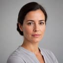 AI agent character portrait: Inês, Finance (DOT Dominus). Rendered — there is no person behind it.